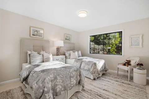 a view of a backyard with a patio and outdoor seating