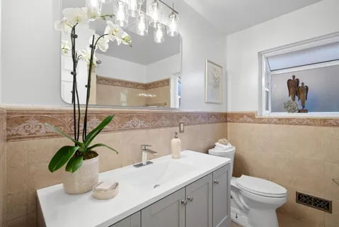 a bathroom with a tub a sink and a shower