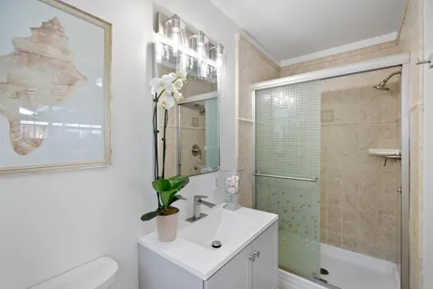 a view of a storage and utility room with washer and dryer