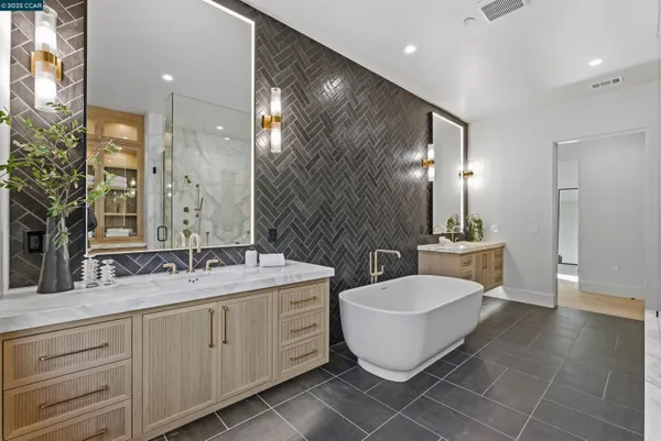 a spacious bedroom with a bed and a large window