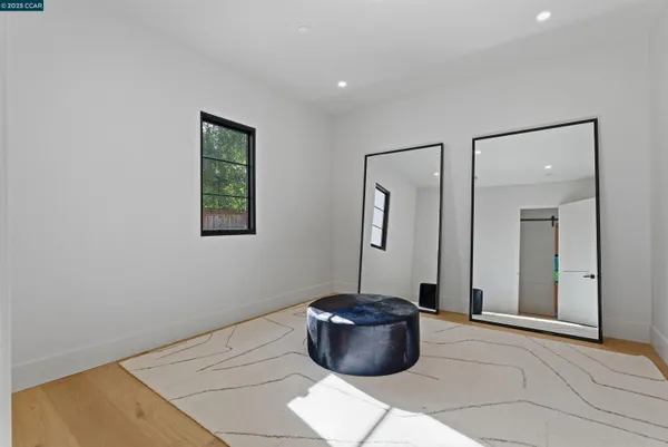 a bedroom with a large bed and a large window