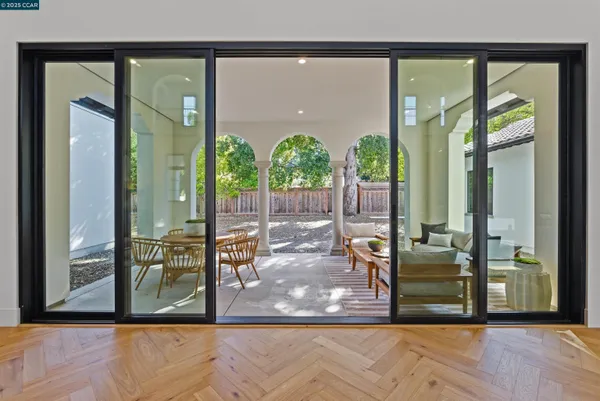 a view of a dining room with furniture window and outside view
