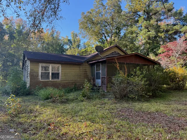 a backyard of a house with seating space