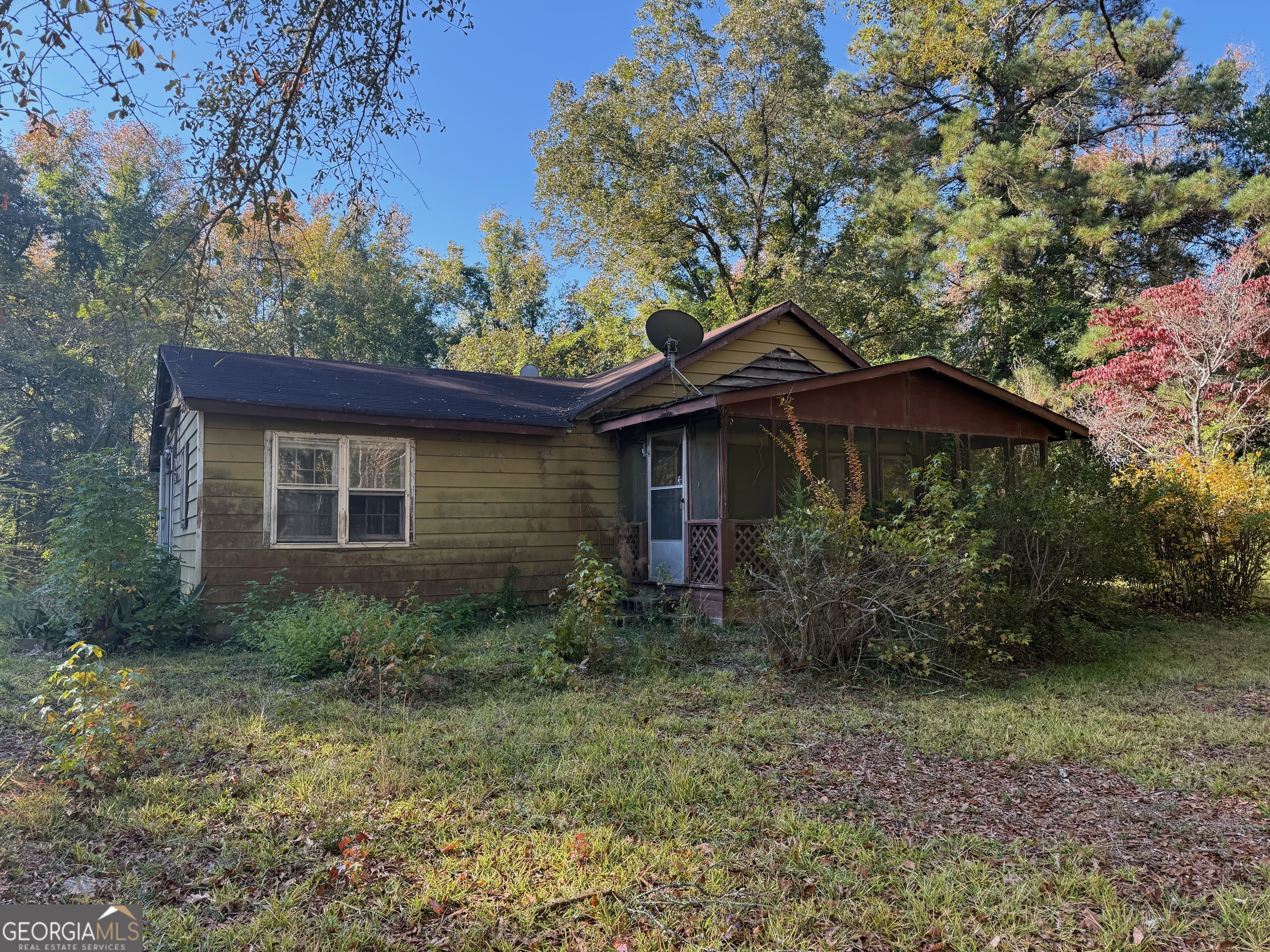 a backyard of a house with seating space