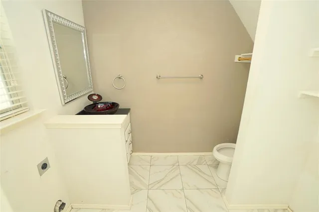 a bathroom with a sink and a toilet