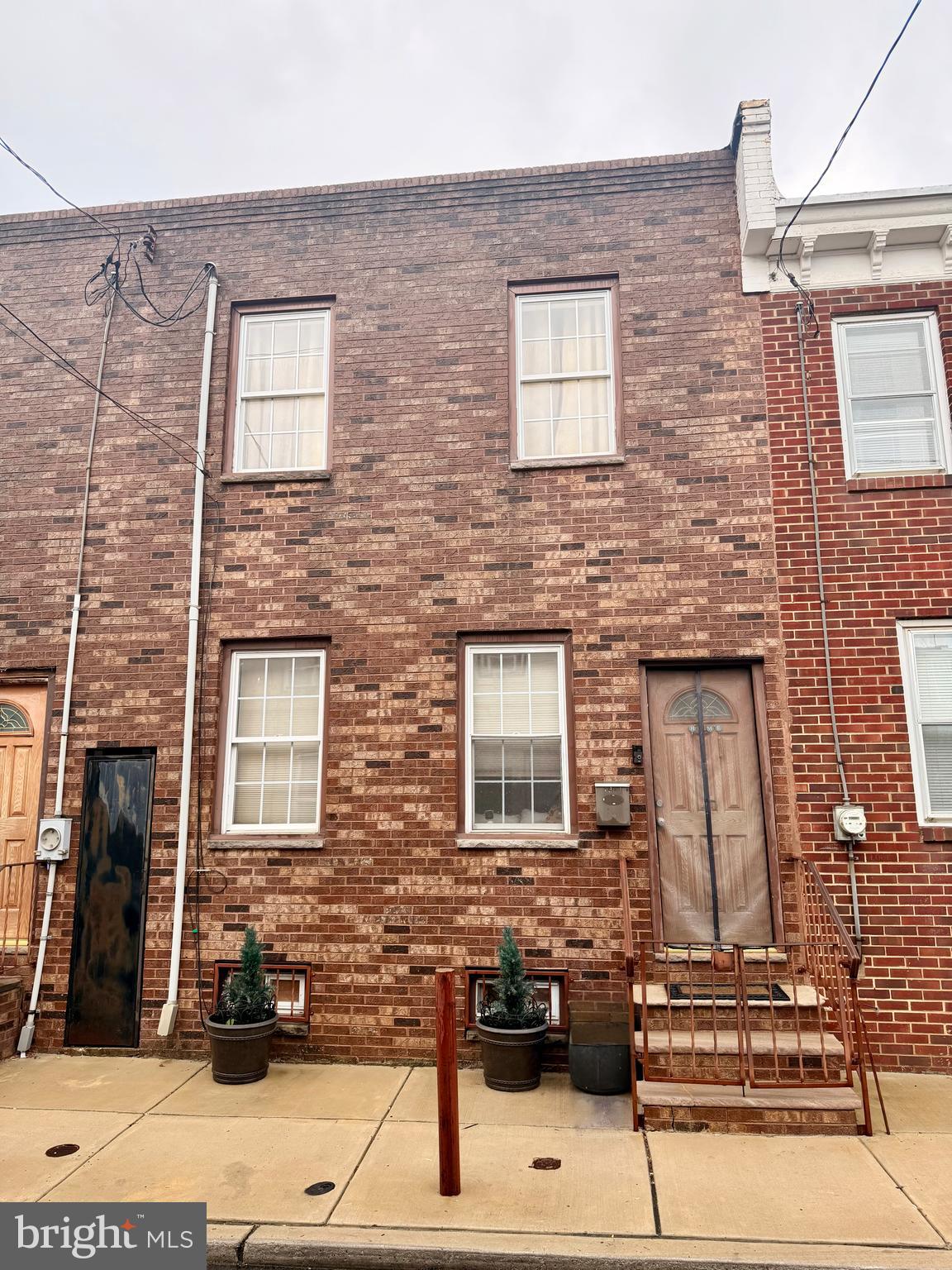 Brick row home with front steps