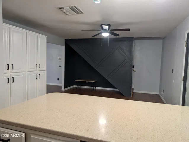 a bedroom with a bed and cabinets