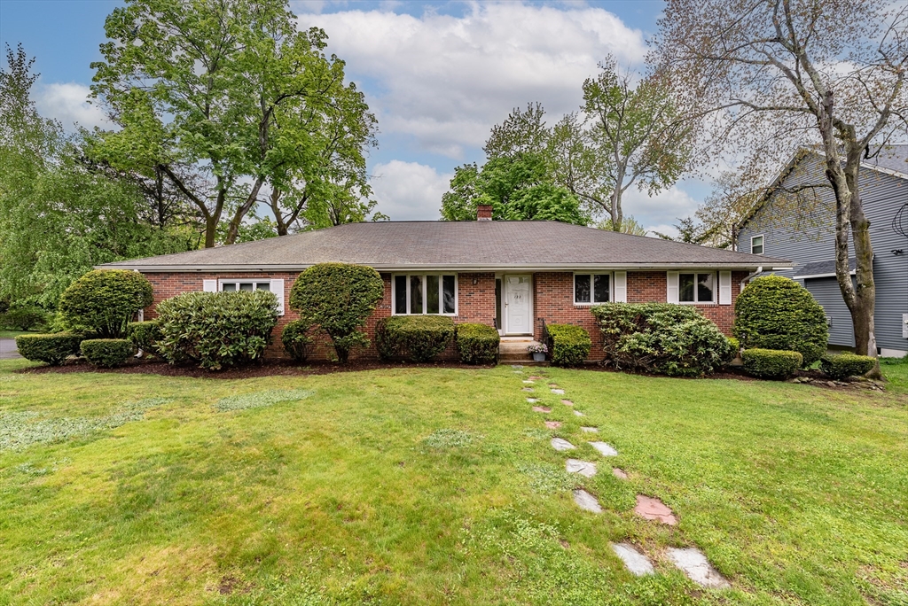 122 Benz Street Springfield, MA 01118 - Photo 1 of 28 a front view of a house with a garden
