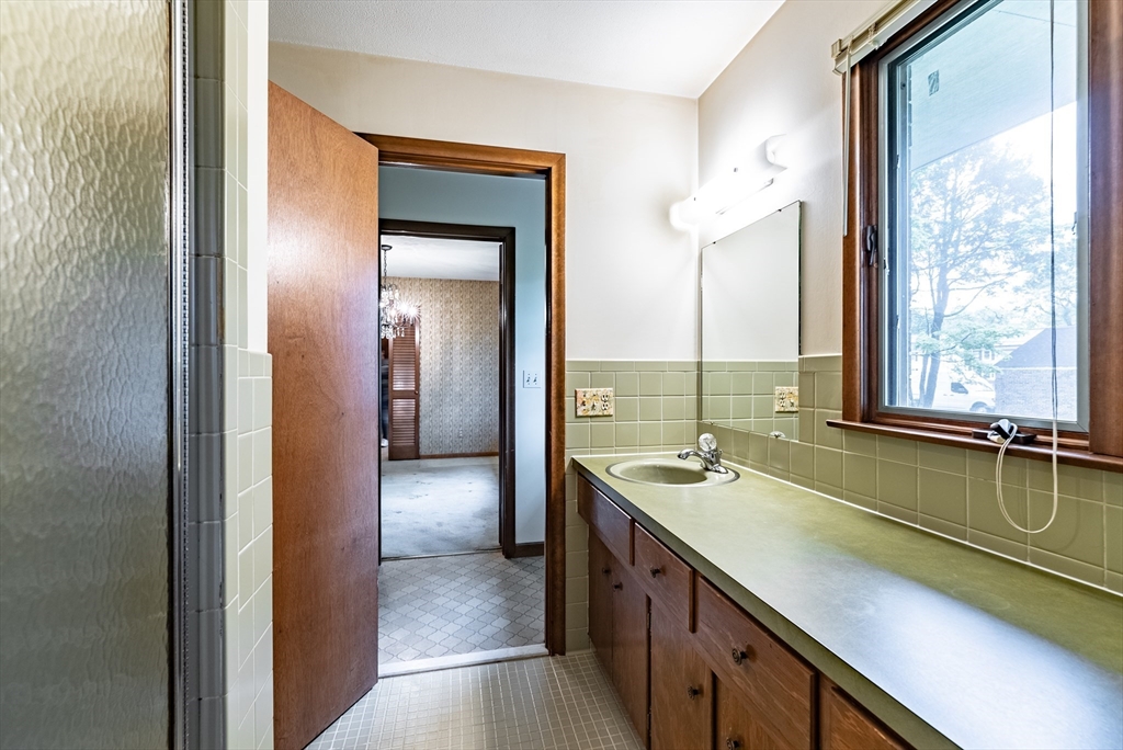 122 Benz Street Springfield, MA 01118 - Photo 19 of 28 a bathroom with a sink and a bathtub