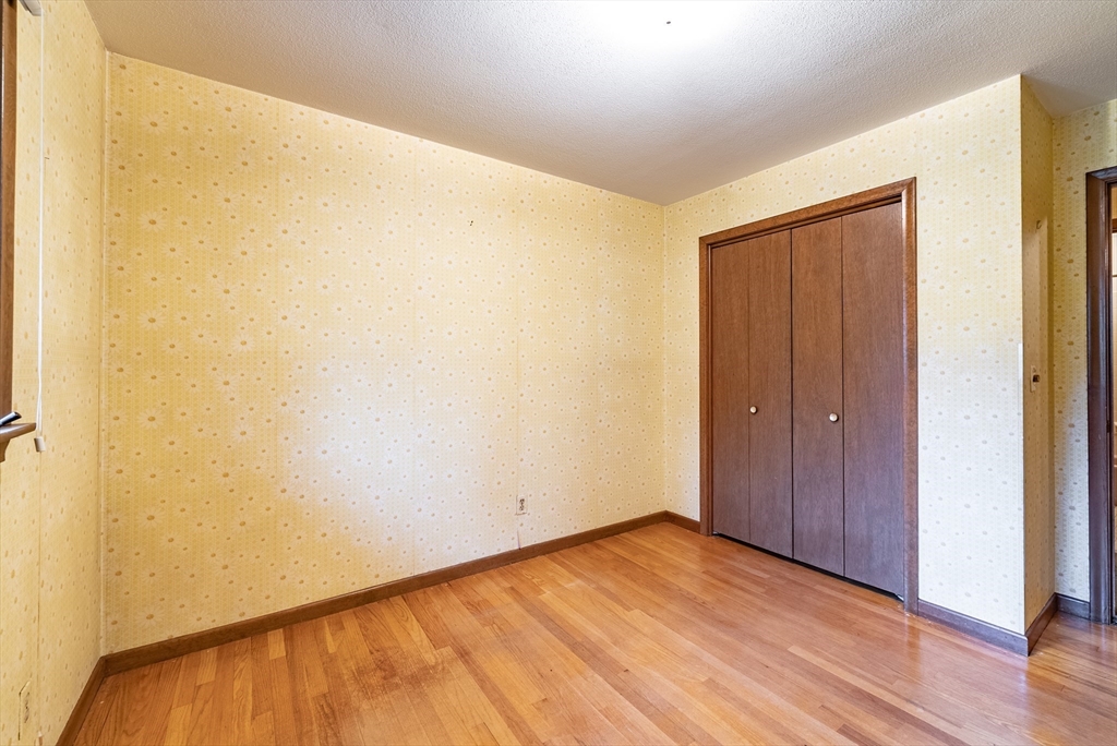 122 Benz Street Springfield, MA 01118 - Photo 24 of 28 a view of empty room with wooden floor