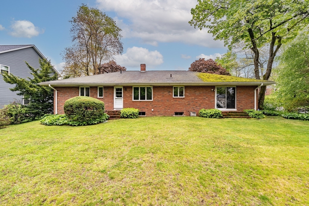 122 Benz Street Springfield, MA 01118 - Photo 27 of 28 a front view of small house with yard and green space