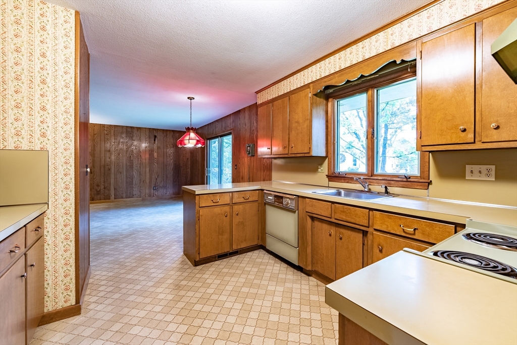 122 Benz Street Springfield, MA 01118 - Photo 3 of 28 a kitchen with a sink cabinets and window