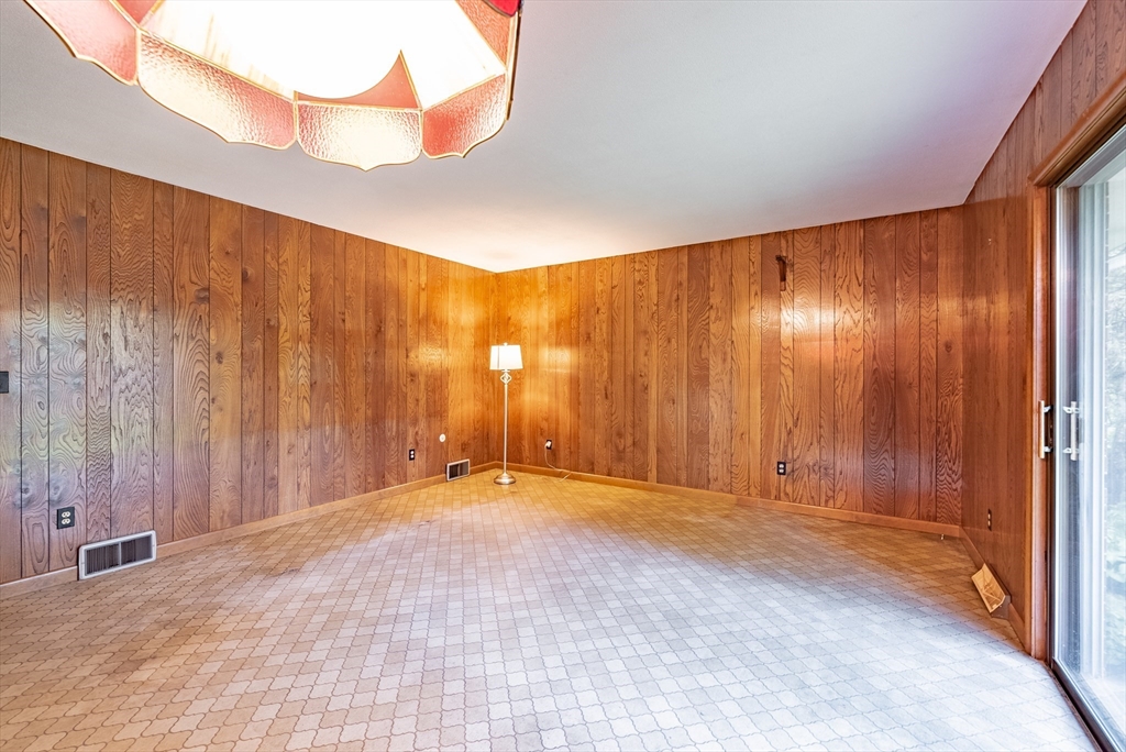 122 Benz Street Springfield, MA 01118 - Photo 8 of 28 a view of an empty room with a window