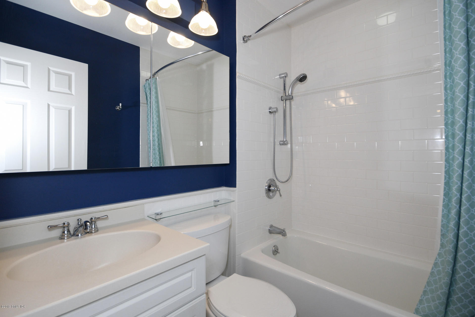 33 Talbot Lane, Unit 3 Greenwich, CT 06830 - Photo 11 of 15 a bathroom with a bathtub shower sink vanity and toilet