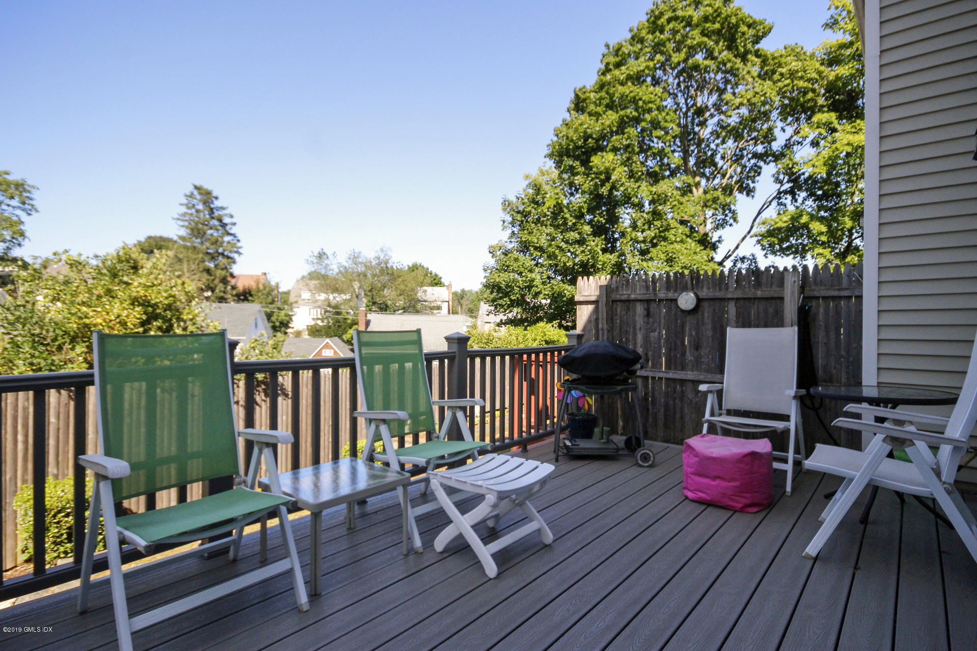 33 Talbot Lane, Unit 3 Greenwich, CT 06830 - Photo 12 of 15 a view of deck with table and chairs potted plants with wooden floor
