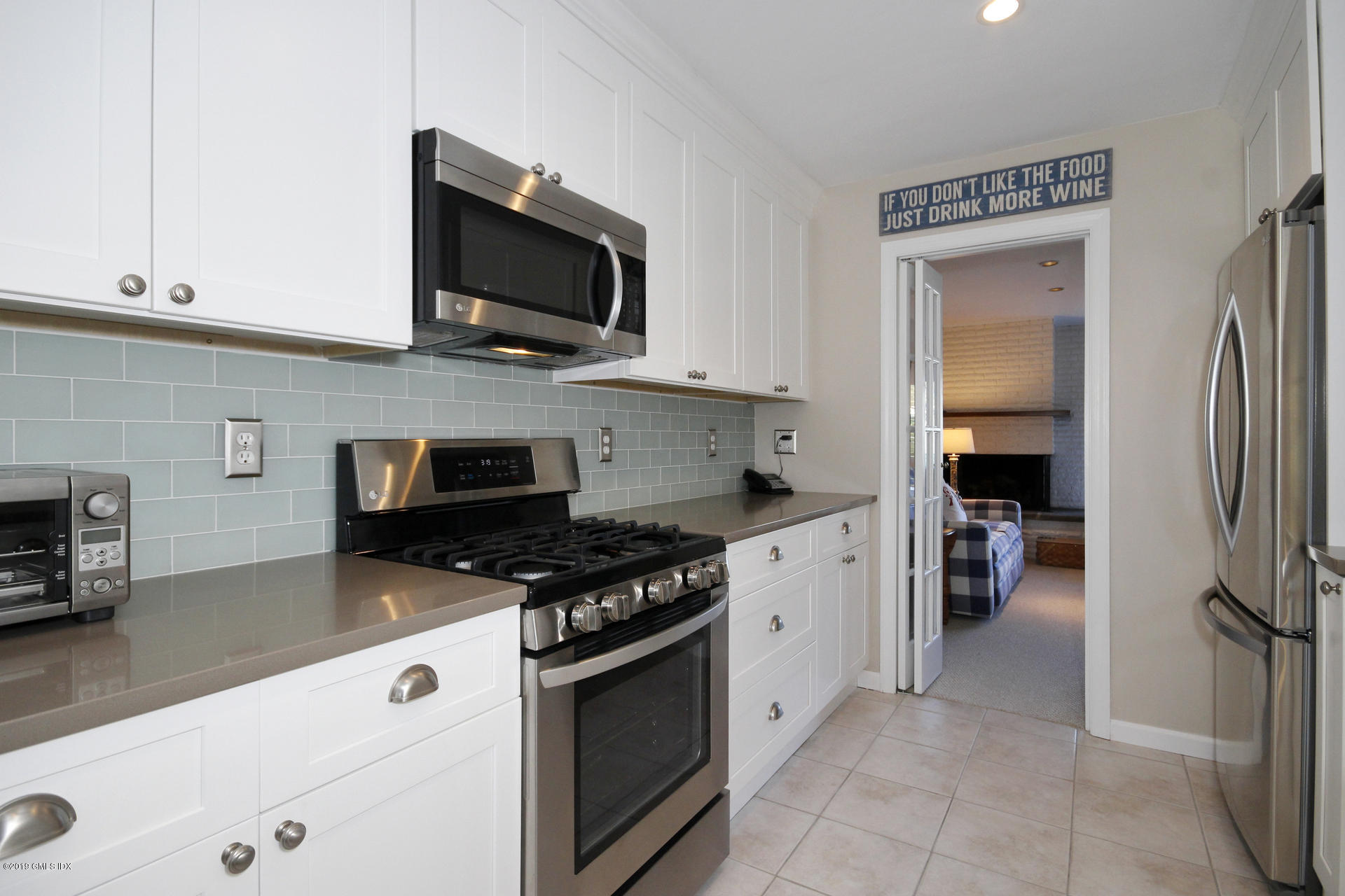 33 Talbot Lane, Unit 3 Greenwich, CT 06830 - Photo 5 of 15 a kitchen with stainless steel appliances granite countertop a stove and a refrigerator