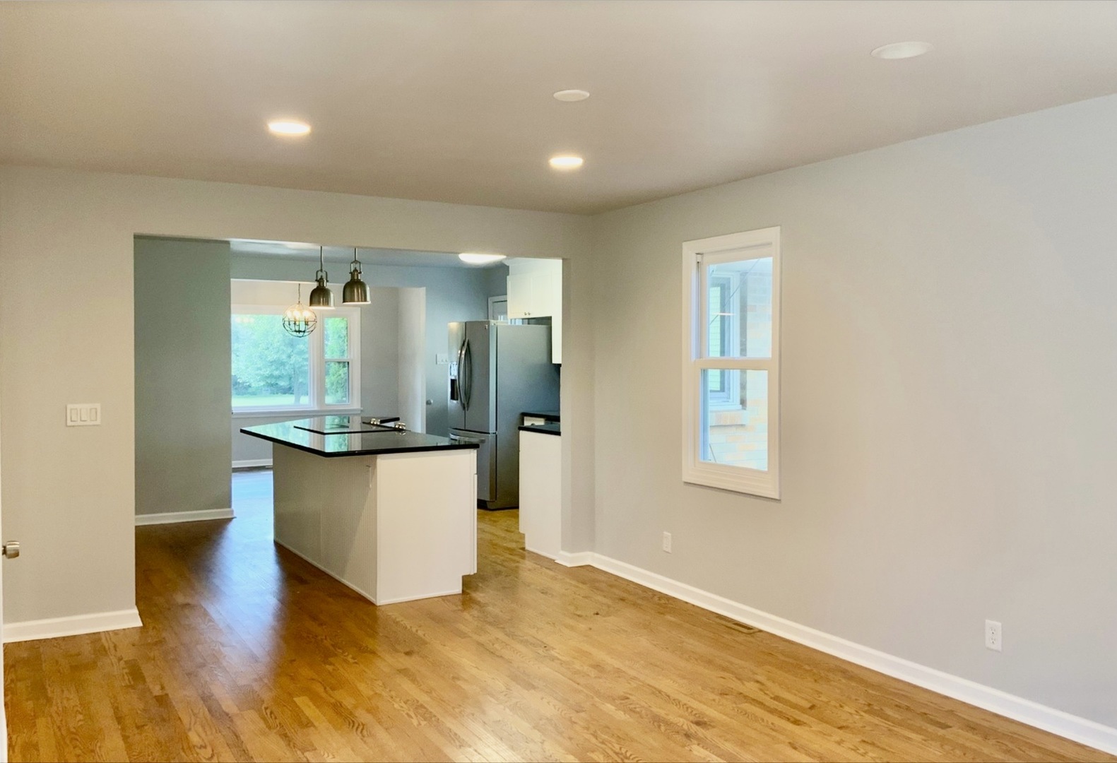 3929 Pinecrest Road Rockford, IL 61107 - Photo 12 of 33 a view of a kitchen with wooden floor and a window