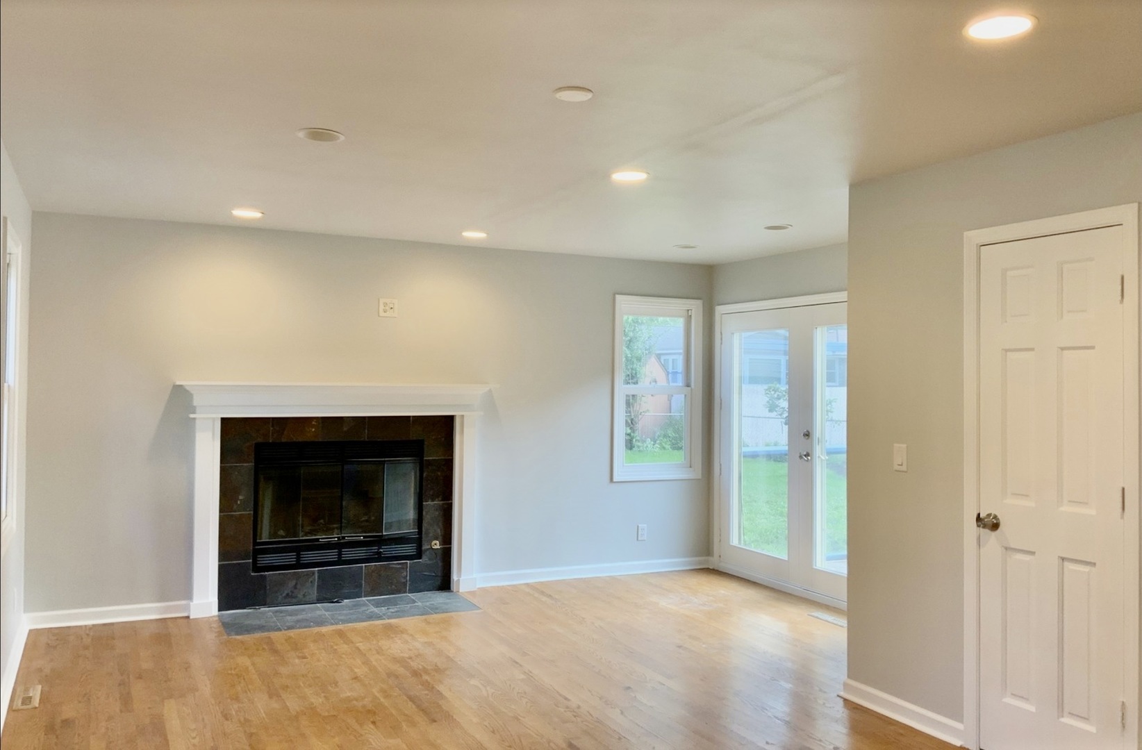 3929 Pinecrest Road Rockford, IL 61107 - Photo 13 of 33 an empty room with windows and fireplace