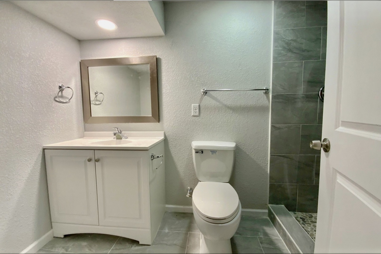 3929 Pinecrest Road Rockford, IL 61107 - Photo 17 of 33 a bathroom with a toilet sink and shower