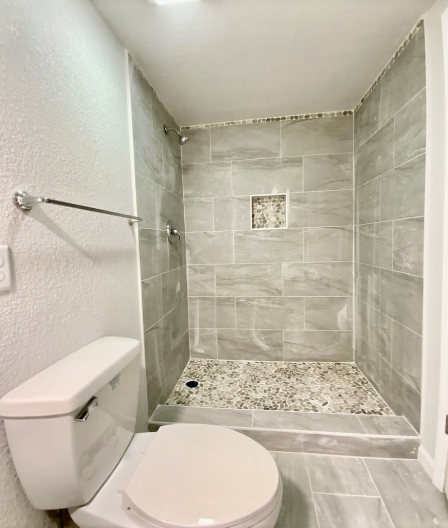 3929 Pinecrest Road Rockford, IL 61107 - Photo 18 of 33 a bathroom with a toilet and a shower