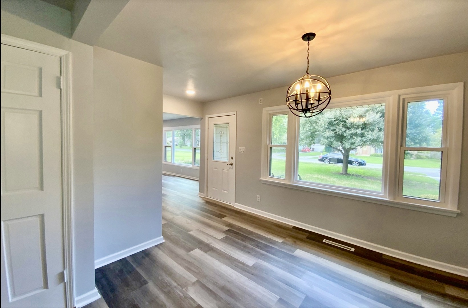 3929 Pinecrest Road Rockford, IL 61107 - Photo 7 of 33 a room with window and wooden floor