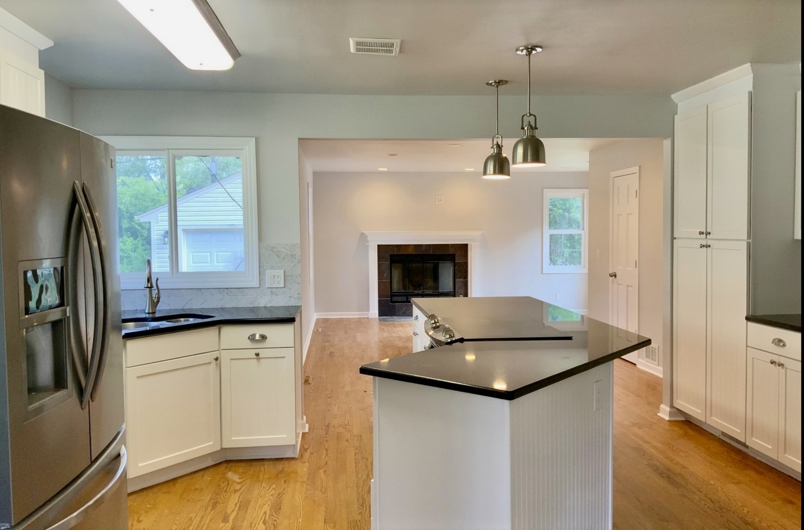 3929 Pinecrest Road Rockford, IL 61107 - Photo 9 of 33 a kitchen with stainless steel appliances granite countertop a sink and a refrigerator