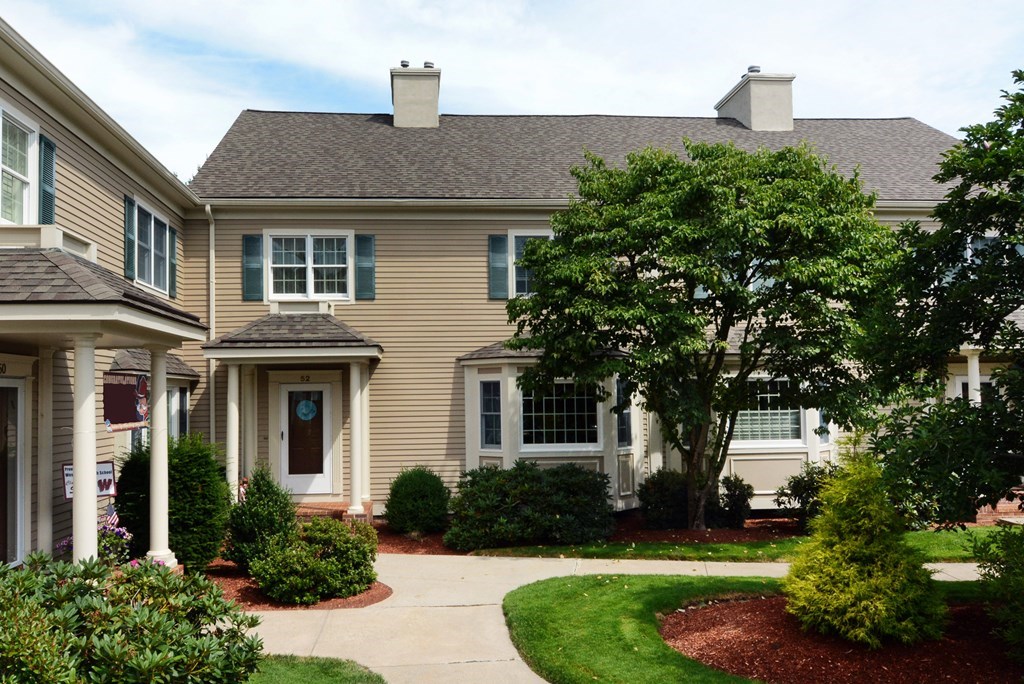 52 Powder Hill Way, Unit 52 Westborough, MA 01581 - Photo 1 of 38 a front view of a house with a yard