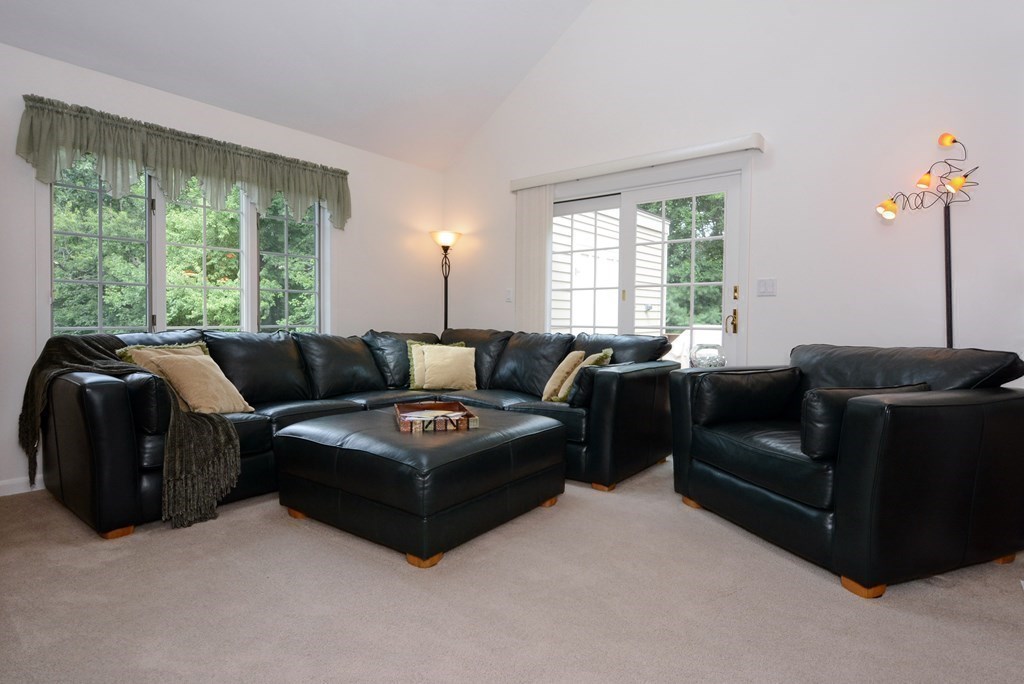 52 Powder Hill Way, Unit 52 Westborough, MA 01581 - Photo 15 of 38 a living room with furniture and a large window