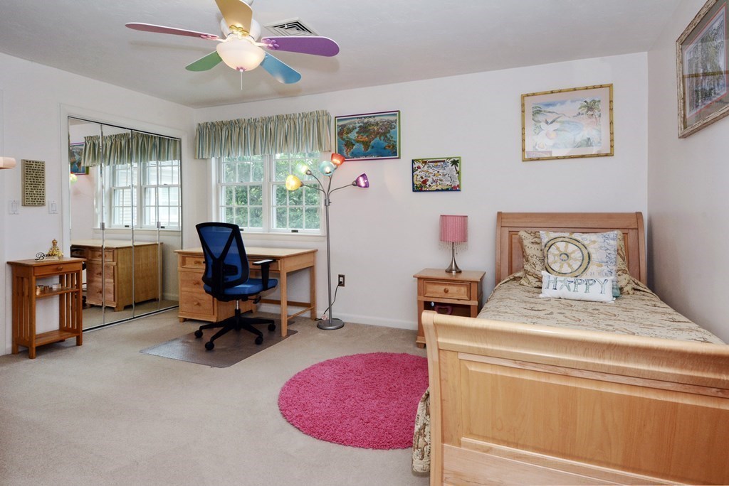 52 Powder Hill Way, Unit 52 Westborough, MA 01581 - Photo 21 of 38 a bedroom with a bed and furniture