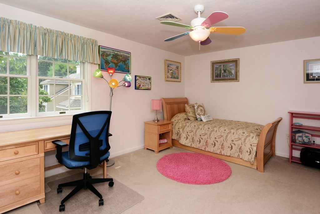 52 Powder Hill Way, Unit 52 Westborough, MA 01581 - Photo 22 of 38 a bedroom with furniture and a large window