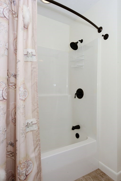 52 Powder Hill Way, Unit 52 Westborough, MA 01581 - Photo 24 of 38 a bathroom with a shower