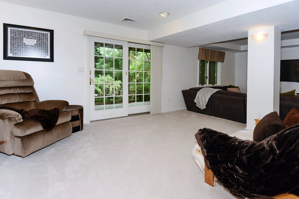 52 Powder Hill Way, Unit 52 Westborough, MA 01581 - Photo 27 of 38 a living room with furniture and a window