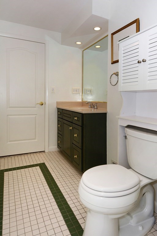 52 Powder Hill Way, Unit 52 Westborough, MA 01581 - Photo 30 of 38 a bathroom with a sink vanity mirror and toilet