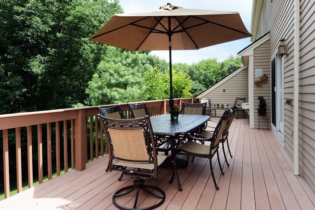 52 Powder Hill Way, Unit 52 Westborough, MA 01581 - Photo 31 of 38 a view of balcony with furniture and wooden floor