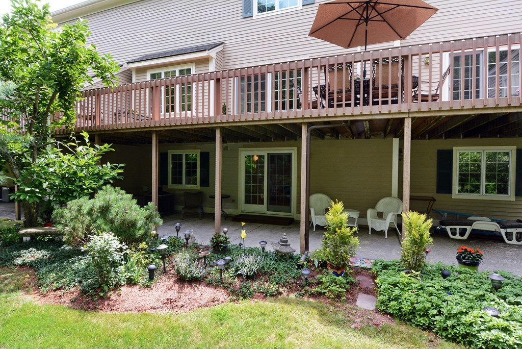 52 Powder Hill Way, Unit 52 Westborough, MA 01581 - Photo 34 of 38 a front view of a house with patio