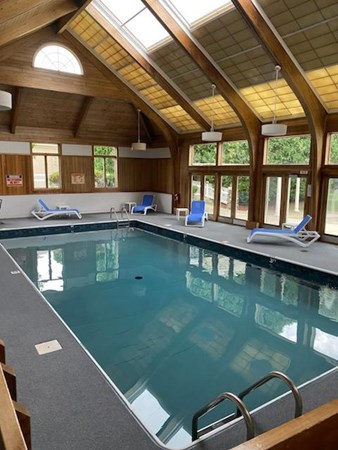 52 Powder Hill Way, Unit 52 Westborough, MA 01581 - Photo 36 of 38 a view of a pool table and chairs in wooden floor