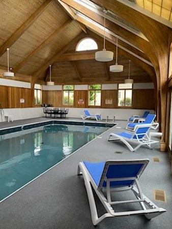 52 Powder Hill Way, Unit 52 Westborough, MA 01581 - Photo 37 of 38 a view of a house with pool and chairs