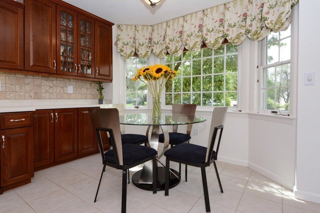 52 Powder Hill Way, Unit 52 Westborough, MA 01581 - Photo 4 of 38 a view of a dining room with furniture and window