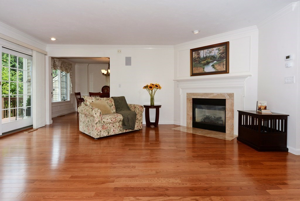 52 Powder Hill Way, Unit 52 Westborough, MA 01581 - Photo 6 of 38 a living room with furniture and a fireplace