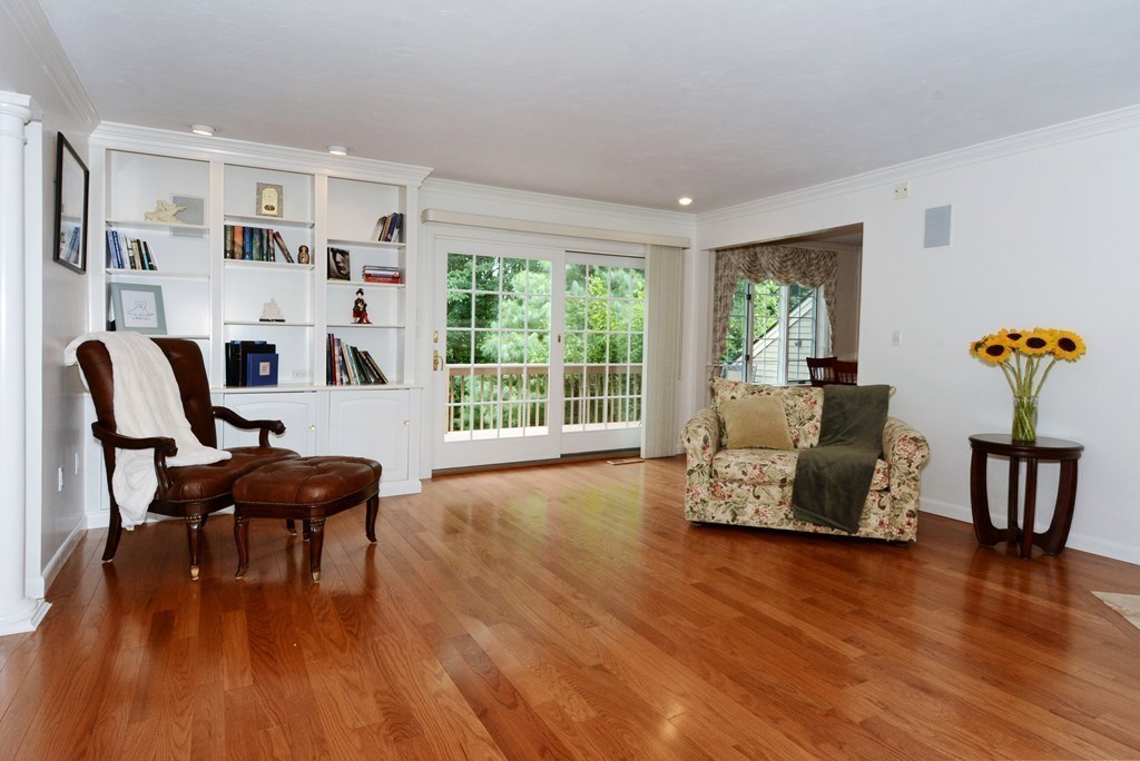 52 Powder Hill Way, Unit 52 Westborough, MA 01581 - Photo 7 of 38 a living room with furniture and a wooden floor