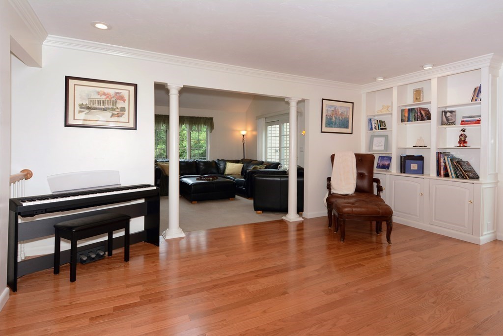 52 Powder Hill Way, Unit 52 Westborough, MA 01581 - Photo 8 of 38 a living room with furniture and a wooden floor