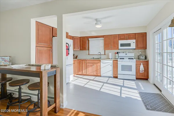 a bedroom with a bed a table and chair
