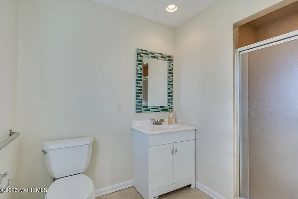 a view of a roof deck with table and chairs a barbeque with wooden floor and fence