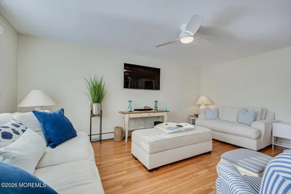 a kitchen that has a sink a stove and cabinets