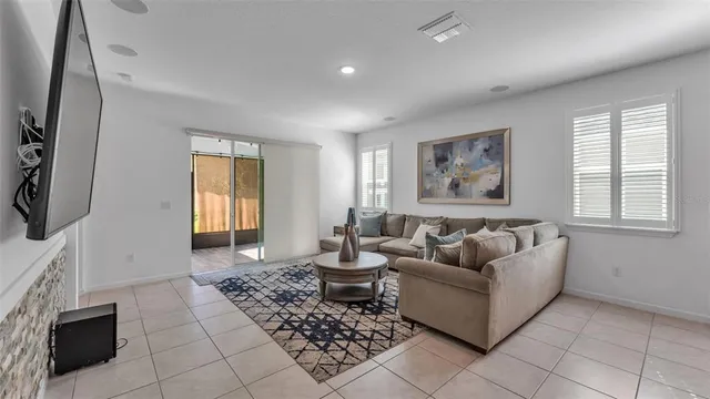 a living room with furniture and a window