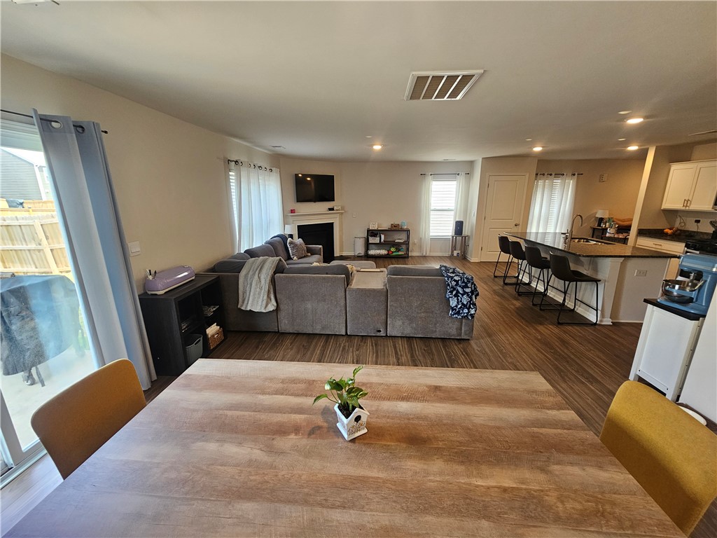 902 Ashwood Lane Easley, SC 29640 - Photo 10 of 39 An open-concept living space with sleek flooring connects the kitchen and dining areas.