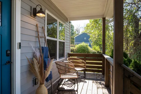 a view of balcony with furniture