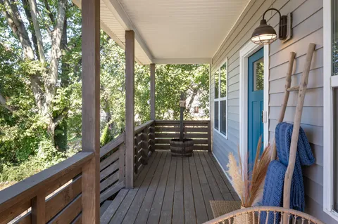 a view of outdoor space with wooden floor and furniture