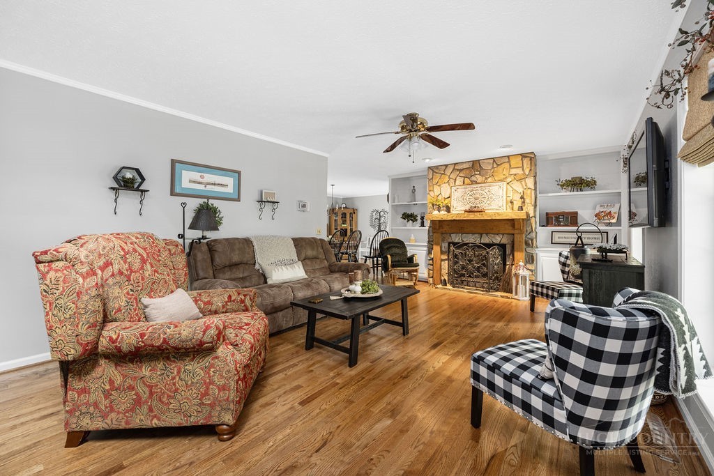 970 Vox Road Sparta, NC 28675 - Photo 20 of 50 a living room with furniture a fireplace and a flat screen tv