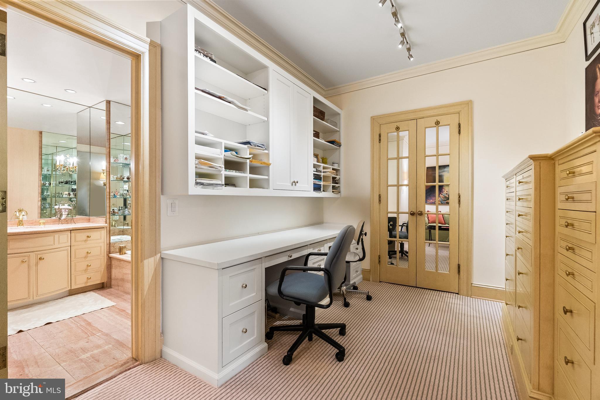 2700 Calvert Street Northwest, Unit 418 Washington, DC 20008 - Photo 16 of 28 a view of a workspace with furniture and windows